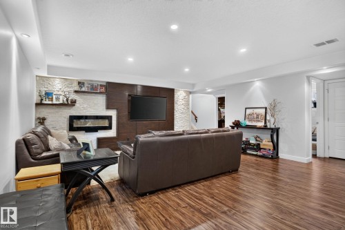 2327 Frezenberg Avenue Nw, Edmonton, AB - Indoor Photo Showing Living Room With Fireplace