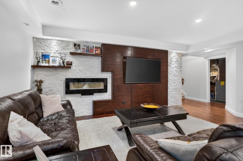 2327 Frezenberg Avenue Nw, Edmonton, AB - Indoor Photo Showing Living Room With Fireplace