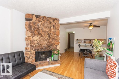 61 Lancaster Terrace Nw, Edmonton, AB - Indoor Photo Showing Living Room With Fireplace