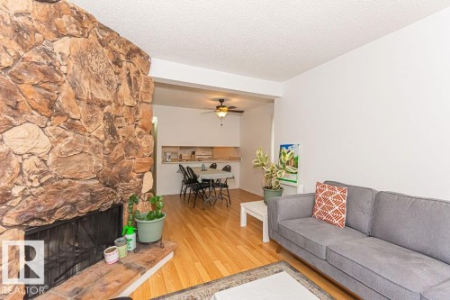 61 Lancaster Terrace Nw, Edmonton, AB - Indoor Photo Showing Living Room With Fireplace