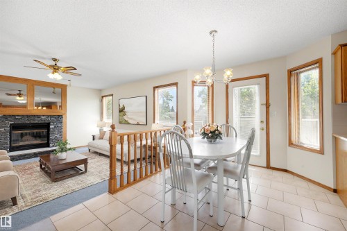 15304 74 Street Nw, Edmonton, AB - Indoor Photo Showing Dining Room With Fireplace