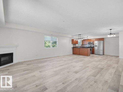 #206 260 Lewis Estates Bv Nw, Edmonton, AB - Indoor Photo Showing Living Room With Fireplace