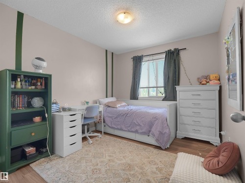 #90 5001 62 St, Beaumont, AB - Indoor Photo Showing Bedroom