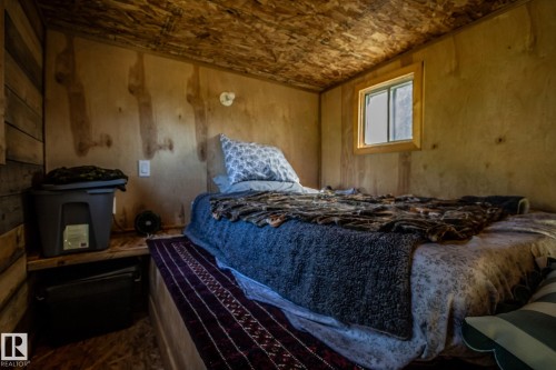 Plywood wall and ceiling finishes, wood-framed window, built-in bed platform - 347, 58532 Range Rd 113, Rural St. Paul County, AB 