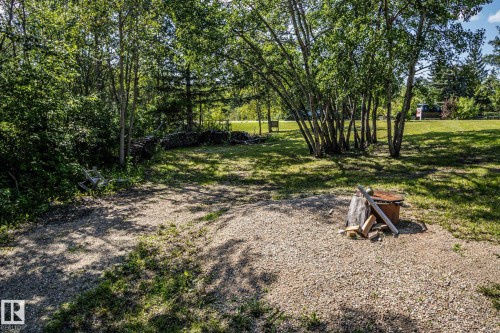 Gravel ground cover with surrounding mature trees and natural landscaping - 347, 58532 Range Rd 113, Rural St. Paul County, AB 
