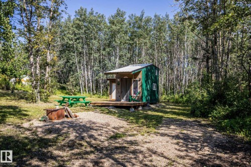 Wood-sided structure with a metal roof and green accent siding - 347, 58532 Range Rd 113, Rural St. Paul County, AB 
