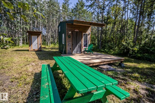 Wood-sided structure with a covered porch - 347, 58532 Range Rd 113, Rural St. Paul County, AB 