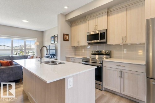 7056 181 Avenue Nw, Edmonton, AB - Indoor Photo Showing Kitchen With Double Sink With Upgraded Kitchen