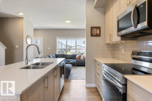 7056 181 Avenue Nw, Edmonton, AB - Indoor Photo Showing Kitchen With Double Sink With Upgraded Kitchen