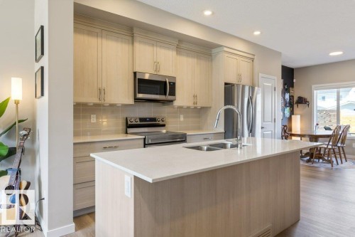 7056 181 Avenue Nw, Edmonton, AB - Indoor Photo Showing Kitchen With Double Sink With Upgraded Kitchen