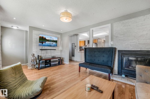 5914 91 Avenue Nw, Edmonton, AB - Indoor Photo Showing Living Room With Fireplace