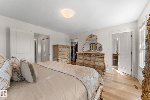 Light wood-finish flooring with white walls - 5415 167A Avenue Nw, Edmonton, AB - Indoor Photo Showing Bedroom