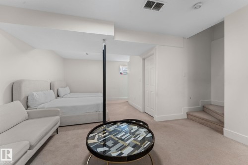 Carpeted flooring, white interior walls, white paneled door, and recessed lighting - 5415 167A Avenue Nw, Edmonton, AB - Indoor