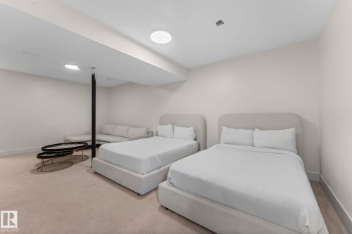 Recessed lighting and ceiling-mounted light fixtures illuminate the space - 5415 167A Avenue Nw, Edmonton, AB - Indoor Photo Showing Bedroom