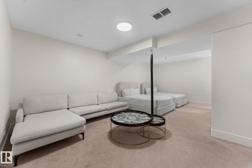 Recessed ceiling lighting, carpet flooring, and a structural column - 5415 167A Avenue Nw, Edmonton, AB - Indoor