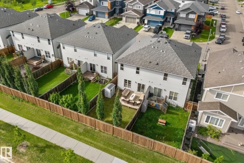 Fenced backyard with mature landscaping and a wooden deck - 5415 167A Avenue Nw, Edmonton, AB - Outdoor