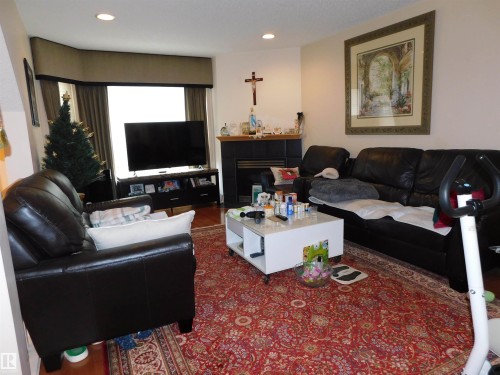 #9 303 Leger Wy Nw, Edmonton, AB - Indoor Photo Showing Living Room With Fireplace