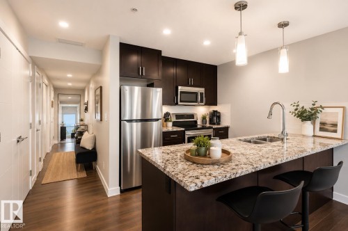 #908 10238 103 St Nw, Edmonton, AB - Indoor Photo Showing Kitchen With Stainless Steel Kitchen With Double Sink With Upgraded Kitchen