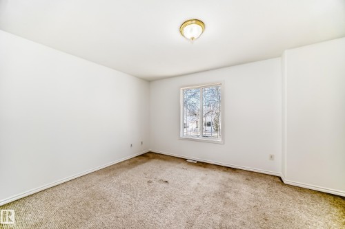Recessed window with white trim, wall-to-wall carpeting, and a flush mount ceiling light - 11727 83 Street Nw, Edmonton, AB - Indoor Photo Showing Other Room