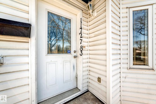 White paneled entry door with decorative glass insert - 11727 83 Street Nw, Edmonton, AB - Outdoor
