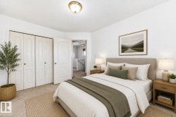 Virtually staged room with illustrating potential of room with furniture, decor and new flooring show a warm neutral wall paint, light-toned carpet flooring, white bi-fold closet doors, and an overhead flush mount light fixture - 