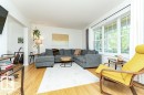 Hardwood flooring, recessed lighting, large pane windows, and an open concept layout - 1539 Kinross Road Nw, Edmonton, AB  - Indoor Photo Showing Living Room 