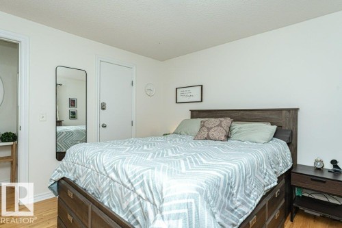 Wood-finish flooring, white walls, and a white ceiling - 1539 Kinross Road Nw, Edmonton, AB - Indoor Photo Showing Bedroom