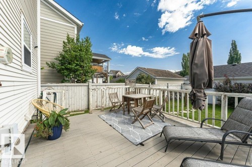 Expansive outdoor deck with a light-toned wood surface and a privacy fence - 1539 Kinross Road Nw, Edmonton, AB - Outdoor With Deck Patio Veranda With Exterior