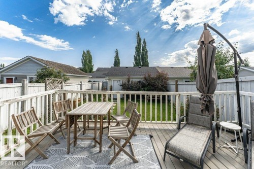Wood-finish deck with white railings - 1539 Kinross Road Nw, Edmonton, AB - Outdoor With Deck Patio Veranda With Exterior