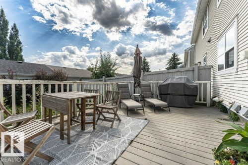 Expansive outdoor deck featuring wood-finish decking and a surrounding privacy fence - 1539 Kinross Road Nw, Edmonton, AB - Outdoor With Deck Patio Veranda With Exterior