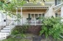 Inviting front porch with white railings and columns, featuring a beadboard ceiling and transom windows - 1539 Kinross Road Nw, Edmonton, AB  - Outdoor With Deck Patio Veranda 