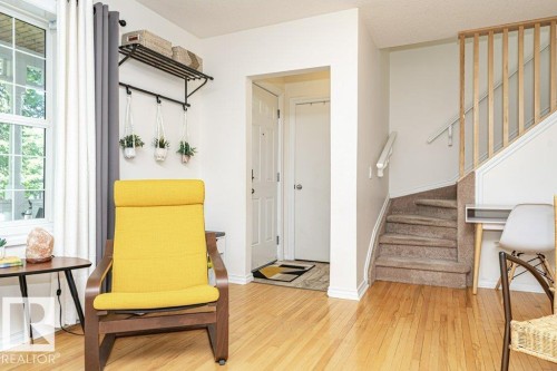 Hardwood flooring throughout the main level - 1539 Kinross Road Nw, Edmonton, AB - Indoor Photo Showing Other Room