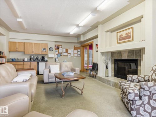 #417 612 111 St Sw, Edmonton, AB - Indoor Photo Showing Living Room With Fireplace
