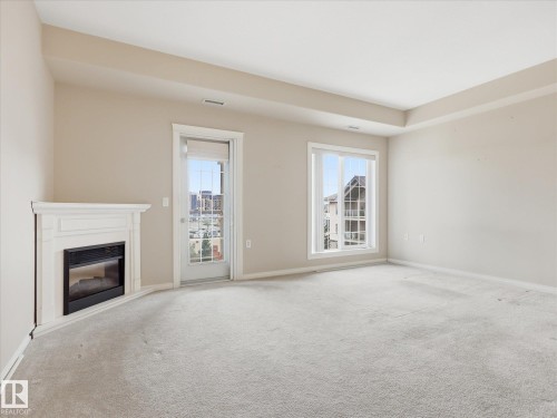 #417 612 111 St Sw, Edmonton, AB - Indoor Photo Showing Living Room With Fireplace