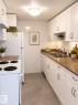 #704 10045 117 St Nw, Edmonton, AB  - Indoor Photo Showing Kitchen With Double Sink 