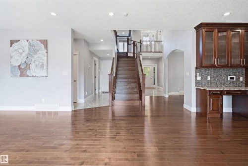 Wood-finish flooring throughout the main level - 427 Windermere Road Nw, Edmonton, AB - Indoor