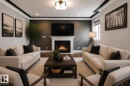 Recessed lighting complemented by a central flush-mount fixture, a white mantel fireplace, a deep accent wall, elegant crown molding, and wood-finish flooring - 427 Windermere Road Nw, Edmonton, AB - Indoor Photo Showing Living Room With Fireplace