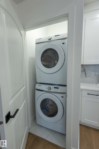 Stacked laundry appliances - 9632 #1 And #2 110 Ave Nw, Edmonton, AB - Indoor Photo Showing Laundry Room