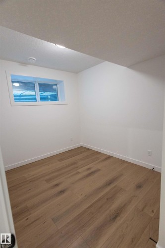 Recessed lighting, wood-finish flooring, and white walls - 9632 #1 And #2 110 Ave Nw, Edmonton, AB - Indoor Photo Showing Other Room
