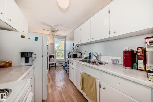#206 7220 144 Av Nw, Edmonton, AB - Indoor Photo Showing Kitchen With Double Sink