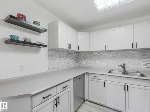 #104 10148 118 St Nw, Edmonton, AB - Indoor Photo Showing Kitchen With Double Sink