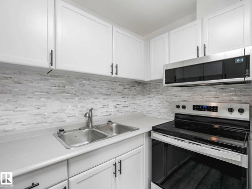 #104 10148 118 St Nw, Edmonton, AB - Indoor Photo Showing Kitchen With Double Sink
