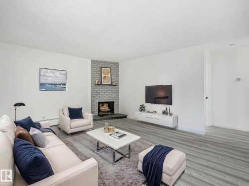#104 10148 118 St Nw, Edmonton, AB - Indoor Photo Showing Living Room With Fireplace