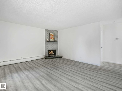 #104 10148 118 St Nw, Edmonton, AB - Indoor With Fireplace