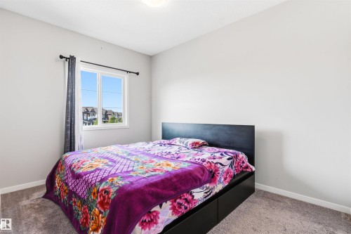 Carpeted flooring, single pane window, and white walls - 1103 26 Avenue Nw, Edmonton, AB - Indoor Photo Showing Bedroom