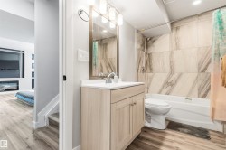 Light wood-finish vanity with a white countertop - 