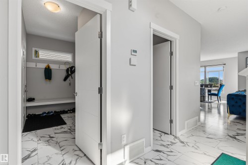 White and grey interior walls, white trim, and white doors - 1103 26 Avenue Nw, Edmonton, AB - Indoor Photo Showing Other Room
