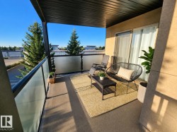 Private balcony featuring a textured floor and frosted glass railing - 