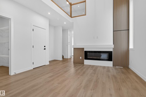 1911 48 St Sw, Edmonton, AB - Indoor Photo Showing Other Room With Fireplace