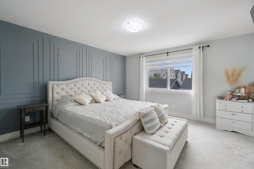 Feature wall with panel molding detail - 7603 Summerside Grande Boulevard Sw, Edmonton, AB - Indoor Photo Showing Bedroom